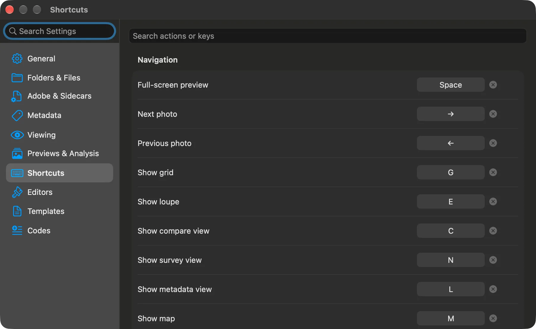 Settings, Shortcuts pane: a searchable list of actions with their keys — Space for full-screen preview, the arrows, G, E, C, N, L and M for the views